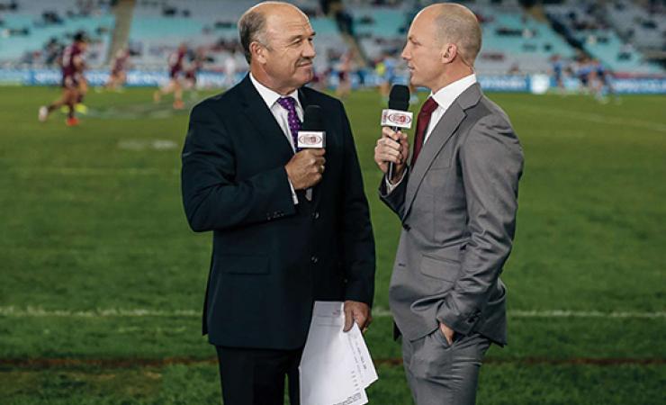 Wally Lewis and Darren Lockyer standing on a rugby league field