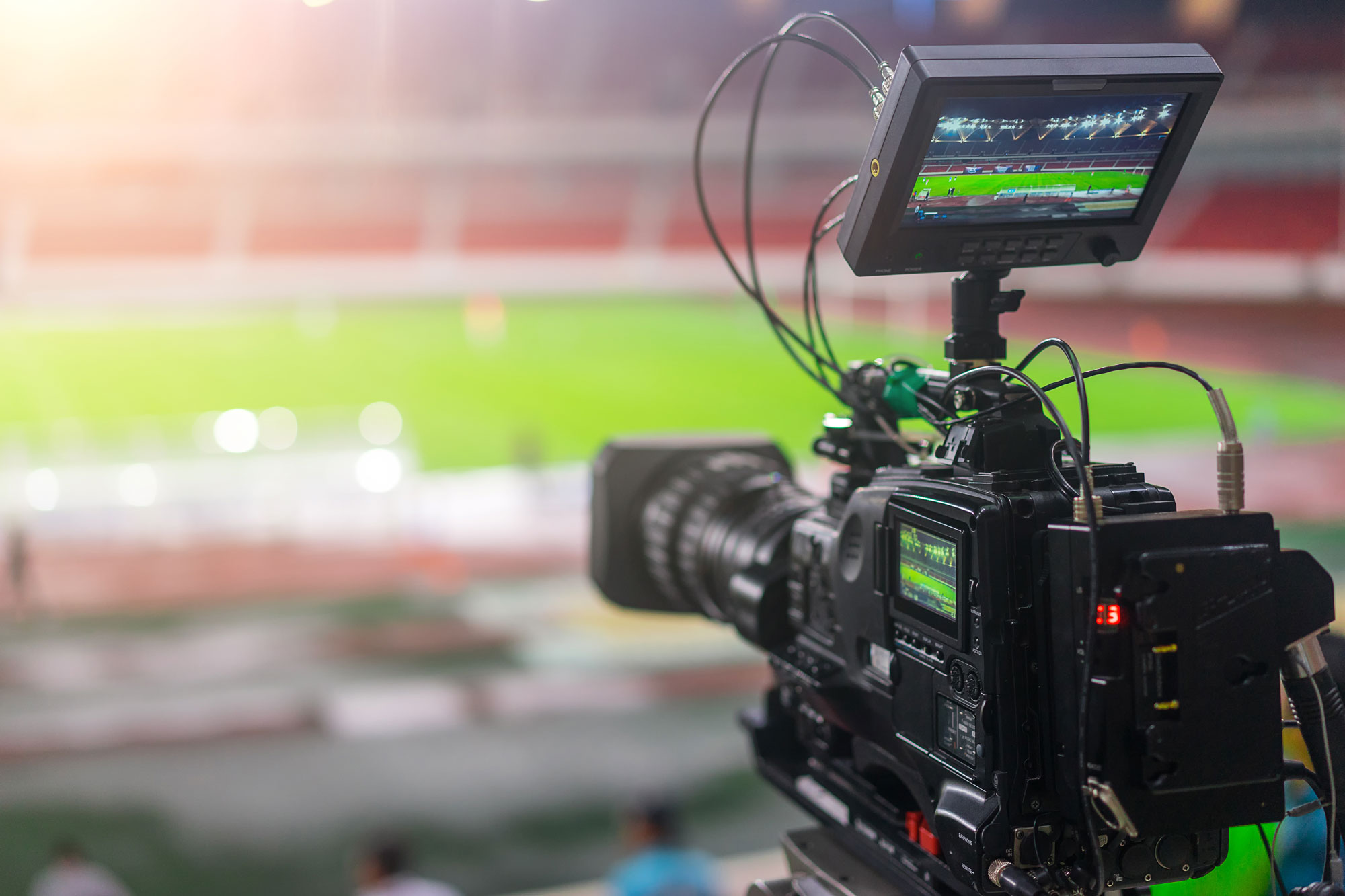 video camera filming sports stadium