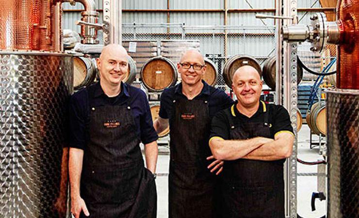 People standing in a gin distillery