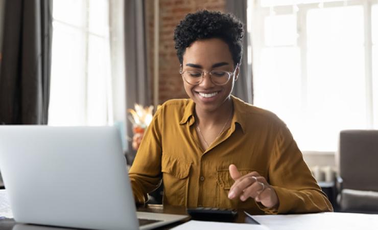 Women smiling looking at laptop 