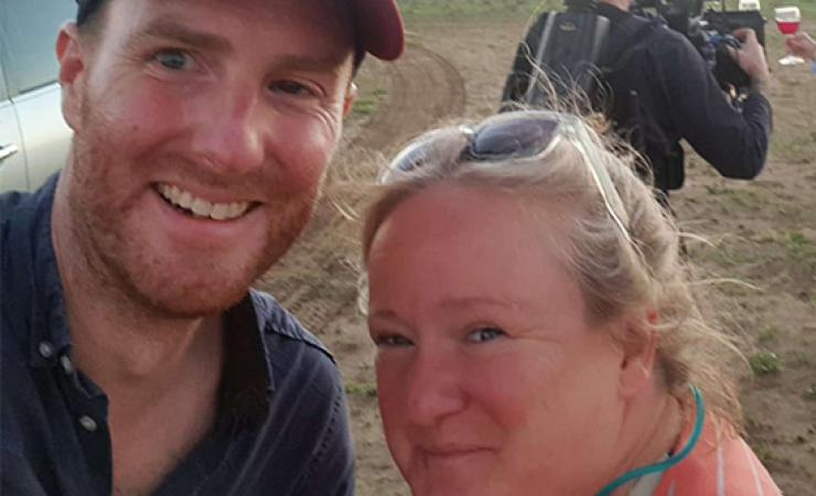 People smiling at camera in the outback