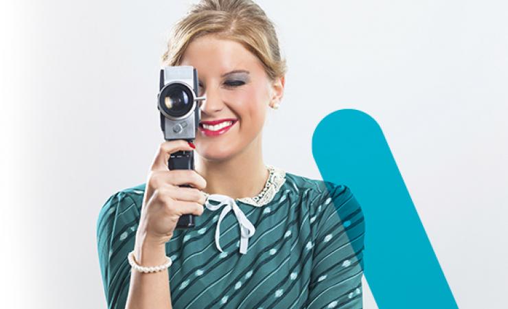 Woman holding old style video camera