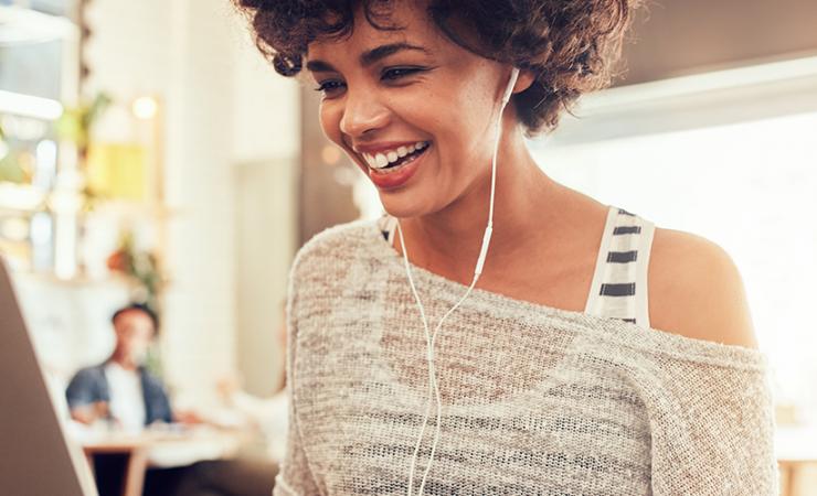 Woman smiling on computer