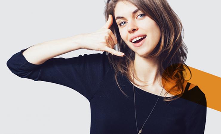 Woman pretending to use her hand as a phone