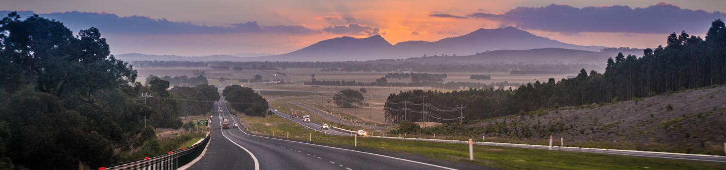 Road with view of sunset over mountains