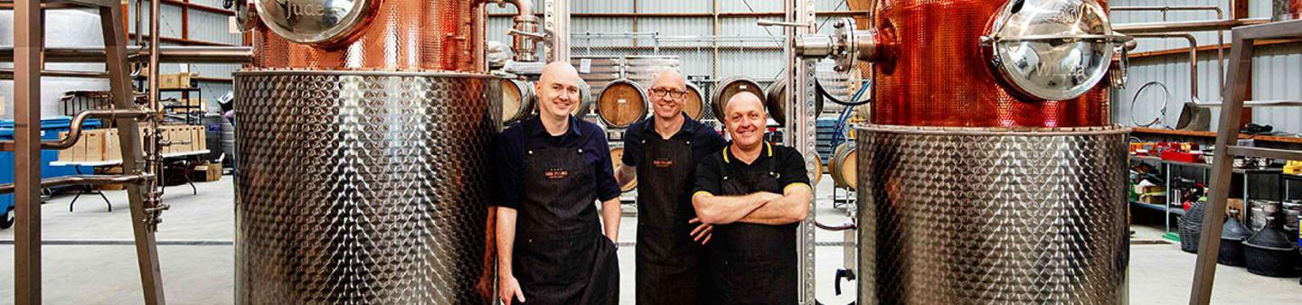 People standing in a gin distillery
