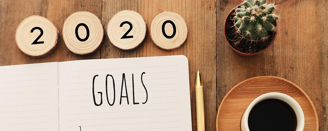 Desk with Goals written on notebook