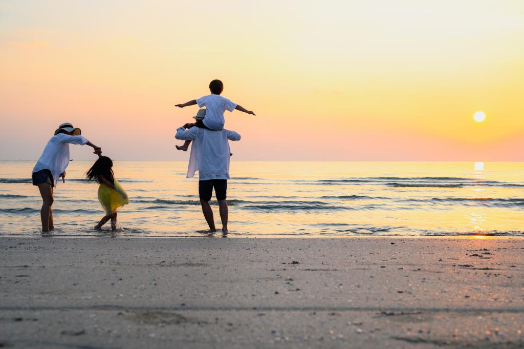 Family playing on beach