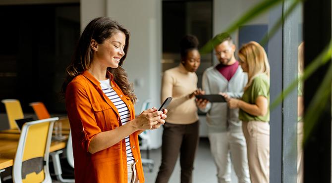 Woman booking travel on phone