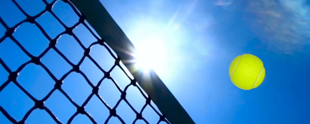 Tennis ball flying over Net